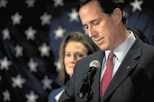 Surrounded by members of his family, Republican presidential candidate and former US senator Rick Santorum, announces the suspension of his campaign yesterday. Poll numbers showed he was losing to Mitt Romney in his home state of Pennsylvania.