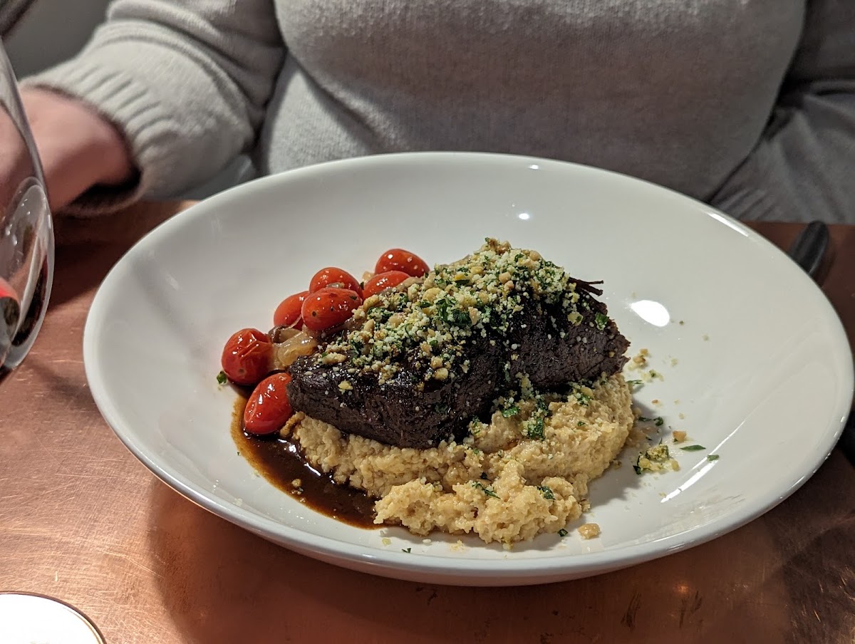 Short rib risotto with polenta, tomatoes, king mushrooms, and a demi glaze