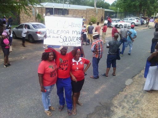 ANC and EFF members gathered outside the Modimolle Magistrate’s Court on Monday.