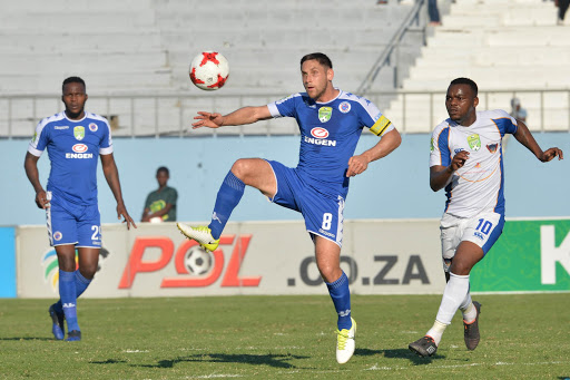 SuperSport United captain Dean Furman (C) passes the ball as his teammate Morgan Gould (L) and Andile Mbenyane of Chippaa United watch on during the Nedbank Cup, Semi Final match at Sisa Dukashe Stadium on May 20, 2017 in East London, South Africa.