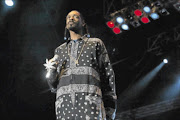 WEED LOVER:
       Snoop Dogg will be performing with his jewel encrusted marijuana leaf covered microphone at the Cannabis Cup.  
      PHOTO: Associated Press