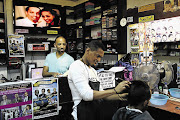 ETHIOPIAN-STYLE: It's not your average barber shop, but then it is situated in an enclave in Johannesburg that seems a long way from South Africa: Little Addis, where members of Joburg's Ethiopian community meet, eat, mingle, buy, sell, barter and get their hair cut.