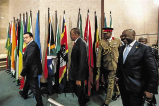 CONSPIRACY OF SILENCE: President Uhuru Kenyatta of Kenya, centre, arrives at the Sixth Ordinary Session of the Third Parliament of the Pan African Parliament held at Gallagher Estate,Midrand Photo: Moeletsi Mabe