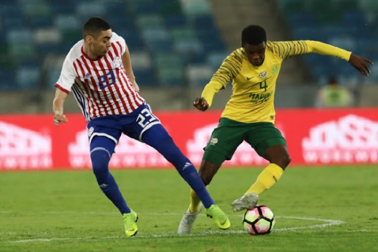 Teboho Mokoena of South Africa and Miguel Almiron of Paraguay during the Nelson Mandela Challenge match between South Africa and Paraguay at Moses Mabhida Stadium on November 20, 2018 in Durban, South Africa.