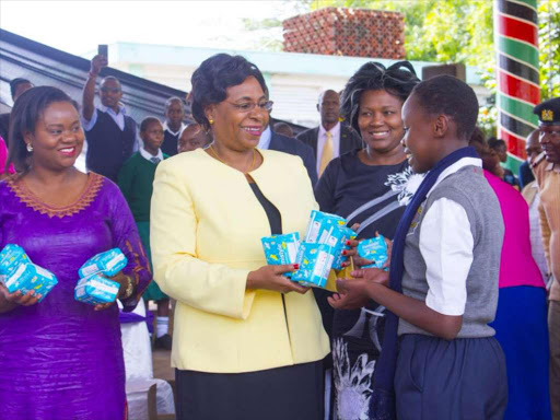 CS Margeret Kobia distribute sanitary towels at Uhuru park when she flagged off the first consignment of GokSanitaryTowels that will benefit millions of girls in schools yesterday.Photo Courtesy