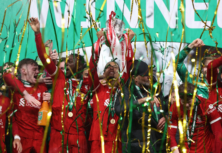 Liverpool manager Juergen Klopp and Liverpool's Virgil van Dijk celebrate winning the Carabao Cup at Wembley Stadium in London, Britain, February 25 2024. Picture: HANNAH MCKAY/REUTERS