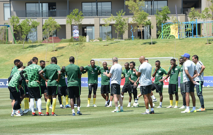 Bafana Bafana coach Stuart Baxter and his assistants in a discussion with the player during a training session at Steyn City School in Fourways, north of Johannesburg, on October 9, 2018. SA take on Seychelles in the 2019 Africa Cup of Nations at FNB Stadium in Soweto on Saturday October 13 2018.