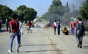 School children seen on the streets of Mahikeng during a protest demanding the resignation of Supra Mahumapelo.