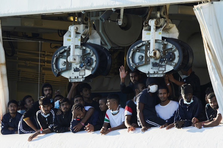 Migrants stay on the rescue ship Geo Barents after Italy allowed the disembarkation of children and sick people, in the port of Catania, Italy, November 7 2022. Picture: ANTONIO PARRINELLO/REUTERS
