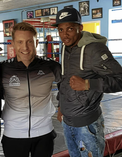 Mfusi Maxhayi and Aphiwe Masengwane will fight for the right to contest the title, vacated by Khanyile "Man Dee" Bulana (R) with his trainer Colin Nathan.
