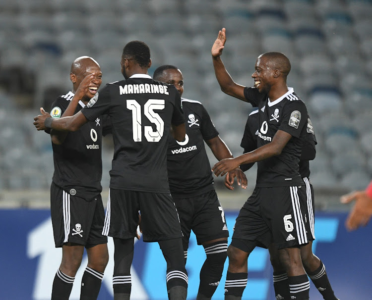 Kabelo Dlamini celebrates with his Orlando Pirates teammates after scoring.