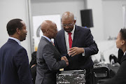 Adv Dali Mpofu (right) talks to former Sars commissioner Tom Moyane at the Commission into State Capture, in Parktown, Johannesburg. Moyane is applying for leave to cross-examine minister of public enterprises, Pravin Gordhan.  13 March 2019. 