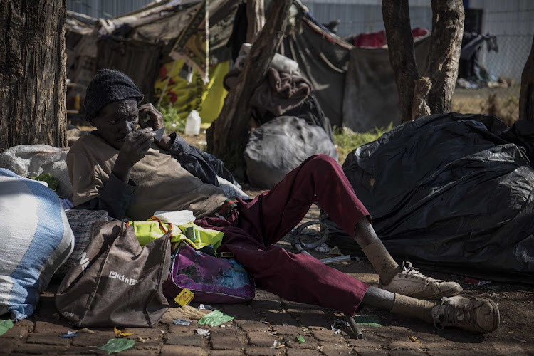 Makhosonke Gumede, 38, was sleeping outside until tents were put up at the shelter behind Wembley Stadium in Johannesburg.