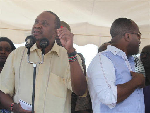 President Uhuru Kenyatta and Mombasa governor Hassan Joho during the launch of Port Reitz - Moi International Airport access road at Changamwe area Mombasa on January 9, 2016 . Photo/ANDREW KASUKU