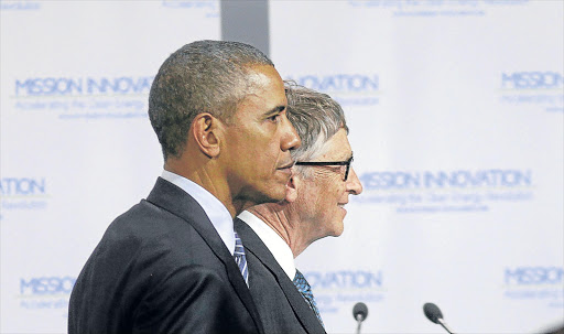 ALL FOR CHANGE: US President Barack Obama, left, stands with Bill Gates during the launch of Mission Innovation, a landmark commitment to dramatically accelerate public and private global clean energy innovation, during the World Climate Change Conference in Paris. Gates also launched the Breakthrough Energy Coalition, a group of private investors who aim to invest in new technologies Picture: REUTERS