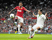 Fabio Cannavaro of New York Cosmos, right, competes for the ball with Nani of Manchester United during Paul Scholes' testimonial match at Old Trafford on Friday. Nani scored twice as United beat Manchester City 3-2 in the Community Shield yesterday Picture: CHRIS BRUNSKILL/GALLO IMAGES
