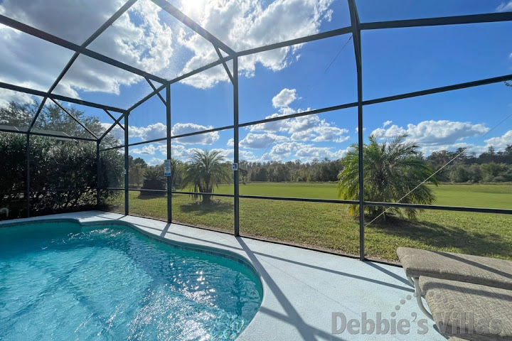 Legacy Park villa in Davenport with a scenic view from the west-facing private pool