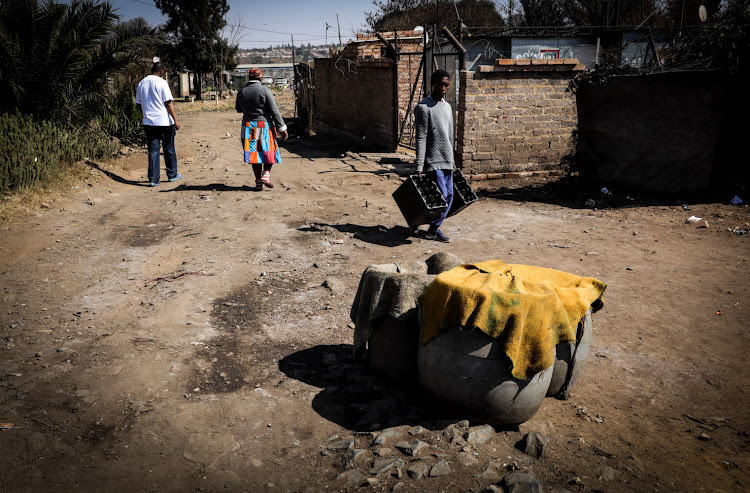 Along with chemical toilets, Kliptown residents also use the bucket system.