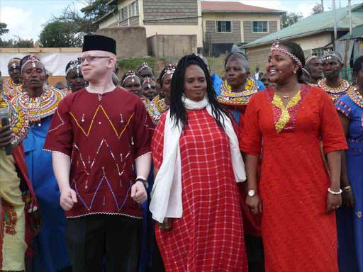 Naisula Lesuuda (right) with Samburu women dancers at SHERP in Maralal town on Sunday, September 4, 2016. On the left is nominated MP Isaac Mwaura /MARTIN FUNDI