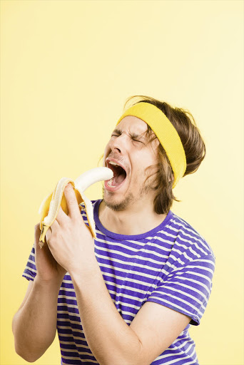 A man eating a banana. File photo.