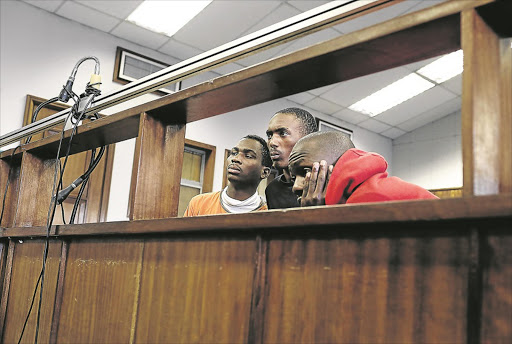 MAY 13, 2015. IN THE DOCK: The accused in the murder case of Mozambican national Emmanuel ' Sithole ' Josias during their appearance in the Alexandra Magistrate's Court. The fourth accused is a minor. Photo Alon Skuy. © TheTimes