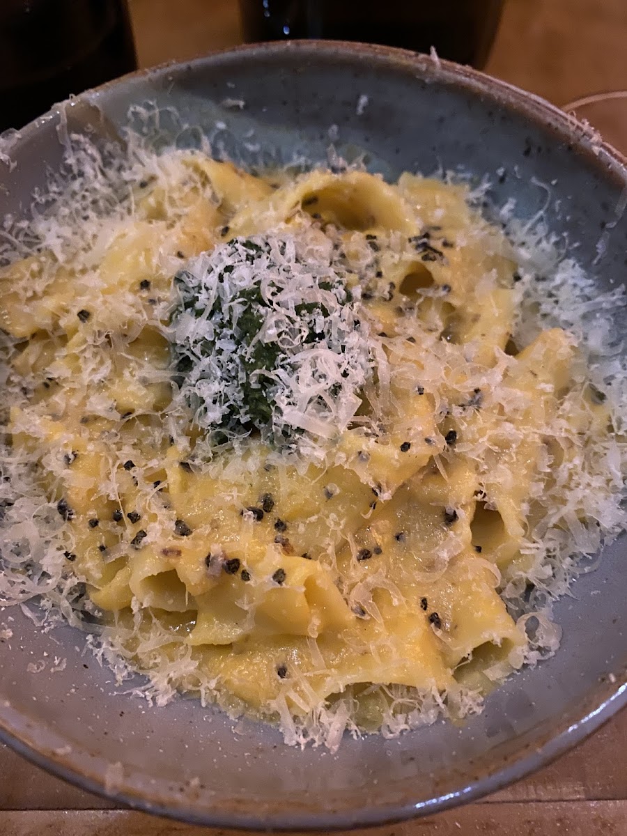 Homemade GF pappardelle pasta with a creamy squash sauce.