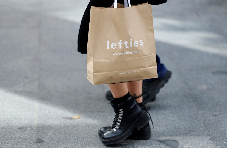 A woman carries a Lefties shopping bag in central Madrid, Spain, on February 16, 2024. REUTERS/JUAN MEDINA