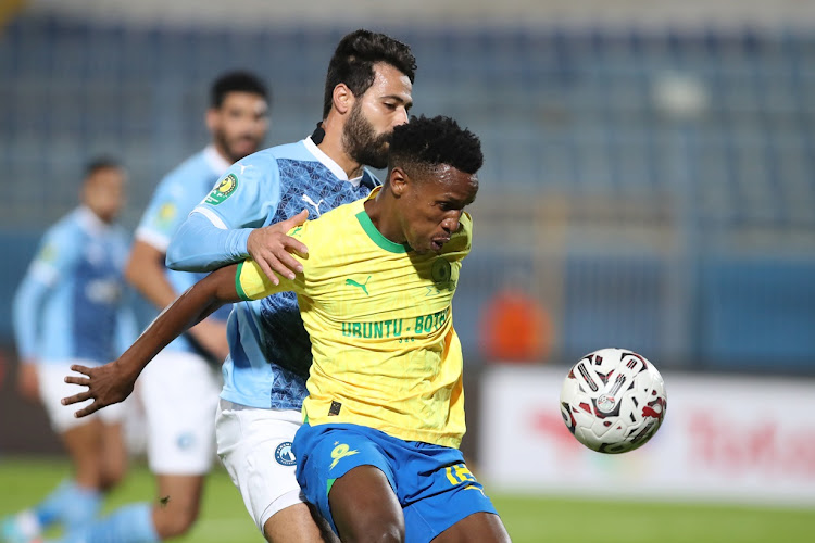 Themba Zwane holds off a defender in Mamelodi Sundowns' Caf Champions League group A win against Pyramids FC at 30 June Stadium in Cairo on Tuesday night.