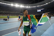 South Africa's Wayde van Niekerk celebrates winning the Men's 400m Final during the athletics event at the Rio 2016 Olympic Games at the Olympic Stadium in Rio de Janeiro on August 14, 2016.