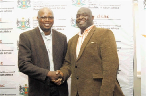 JOLLY GOOD LUCK: Phil Masinga and MEC Hlomane Chauke. PHOTO: BOITUMELO TSHEHLE