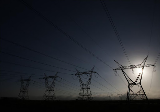 Eskom's National Grid Pylons carrying SA's electricity buzz & hum at sunset outside Koeberg Nuclear Power Station. File photo.