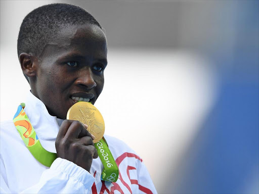 Kenya-born athlete Ruth Jebet poses with her gold medal after winning the 3,000m steeplechase while racing for Bahrain in the Rio games, August 15, 2016 /REUTERS