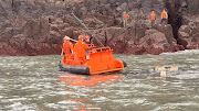 Members of Taiwan's coast guard work during a rescue operation after a Chinese fishing boat capsized near Taiwan-controlled Kinmen islands, off the coast of Dongding Island, Kinmen County, Taiwan, in this handout image released on March 14, 2024.   