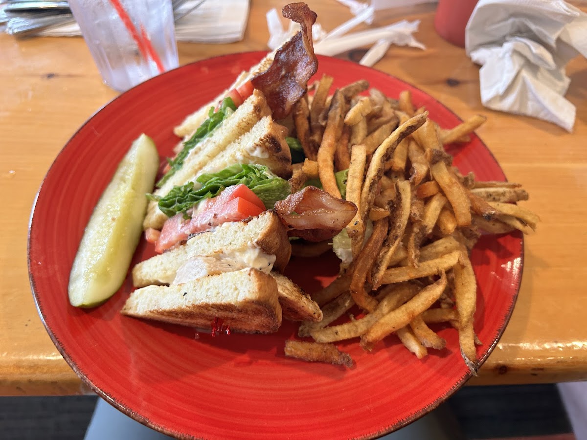 Club sandwich with house GF white bread and french fries from dedicated fryer