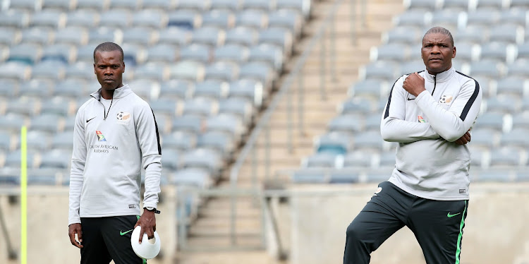 Bafana Bafana head coach Molefi Ntseki (R) and his assistant Arthur Zwane (L) during a training session.