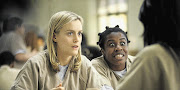 SMART: Taylor Schilling, left, with Uzo Aduba, is the focus of the show's moral education, whether you care about it or not
