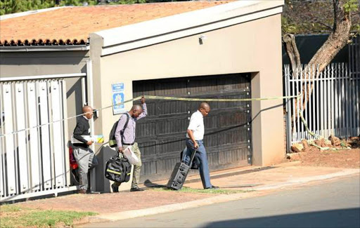 SAPS forensic officers leave the Naidoo family's house in Northcliff. File photo. PICTURE: MASI LOSI