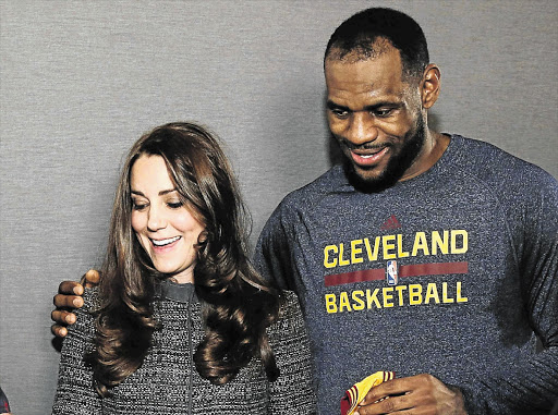 SHOULDER 'CHARGE': Catherine, Duchess of Cambridge, with basketball star LeBron James, who has caused something of a storm in the royal tea cup