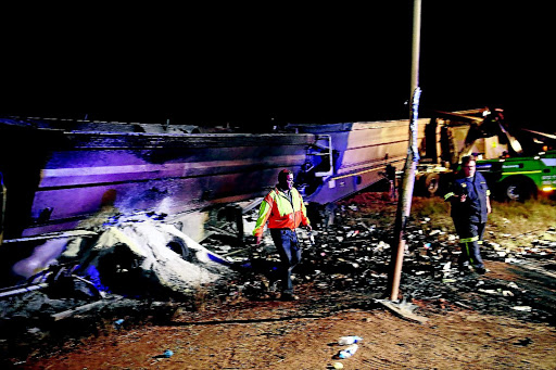 Aftermath of a major taxi and truck crash on the R25 when 20 people were killed, including 18 school children. / ALON SKUY