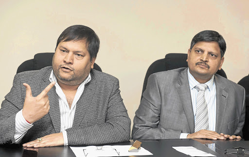 Businessmen Ajay Gupta and his younger brother Atul.