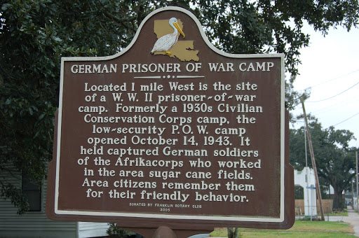 Located 1 mile west is the site of a W.W. II prisoner-of-war camp. Formerly a 1930s Civilian Conservation Corps camp, the low-security P.O.W. camp opened October 14, 1943. It held captured German...
