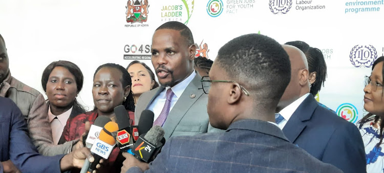 Principal Secretary State Department of Environment & Climate Change(Centre) speaking at the sidelines of the multi stakeholder forum in Nairobi.