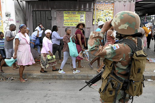 People who arrived in droves to buy food at a Boxer supermarket in Alexandra, Johannesburg, were ordered by soldiers to go home to maintain social distancing.