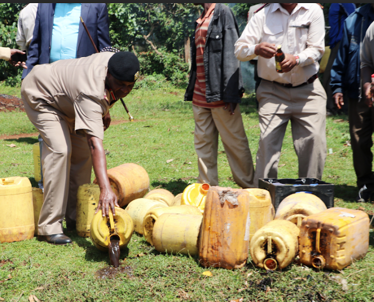 Security officers pour illicit brews during crackdown in Kirinyaga