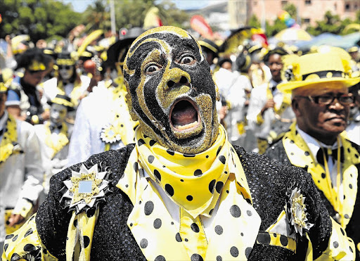 JOU MA SE KLOPSE: Haroon Djingels of Cape Town's Pennsylvanians troupe entertains the crowd during the Cape Minstrels' annual carnival parade in Cape Town on Saturday