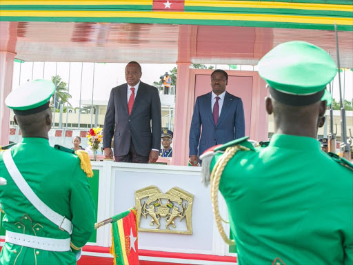 President Uhuru Kenyatta when he was received by his Togolese counterpart Faure Essozimna Gnassingbé, on arrival at Gnassingbe Eyadema International Airport Lomé, Togo on Friday, October 14. /PSCU