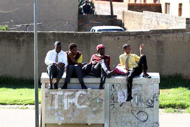 Soweto pupils relax at a local park while their teachers are away on a Sadtu march. The teachers' union is coming under increasing scrutiny.
