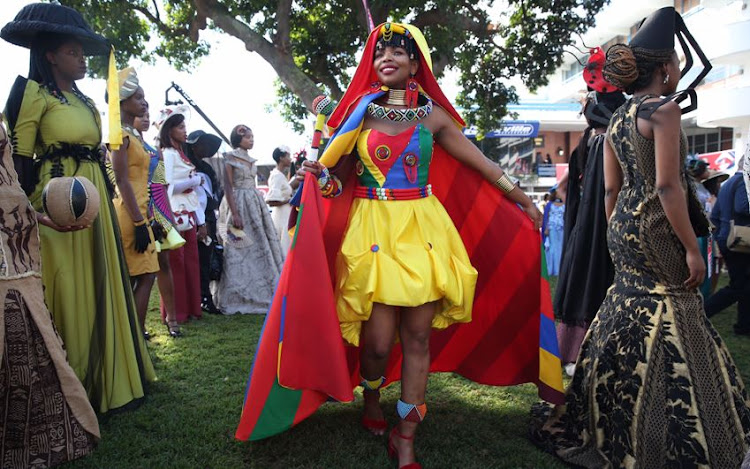 Nozipho Zuma wearing a colourful outfit by Lindo Mathebula at the Vodacom Durban July.