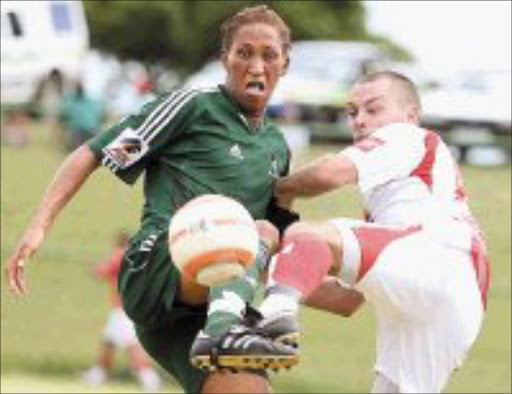 GET LOST: Bulelani Matroos of AmaZulu, on the ball, fights with Brett Evans of Ajax at Princess Magogo stadium in KwaMashu yesterday. Pic. Mandla Mkhize. © Sowetan.