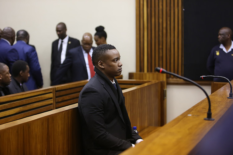 Duduzane Zuma sits nervously at the start of the court ruling.